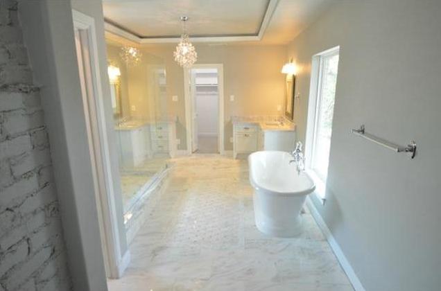 Master bath with marble floors & walk-in closet