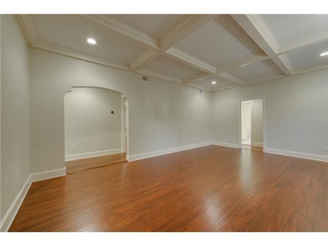 Living room - master suite through arched doorway, and full bath