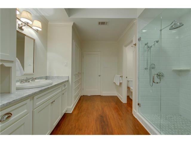 Master bath - rain shower head and linen cabinets shown.