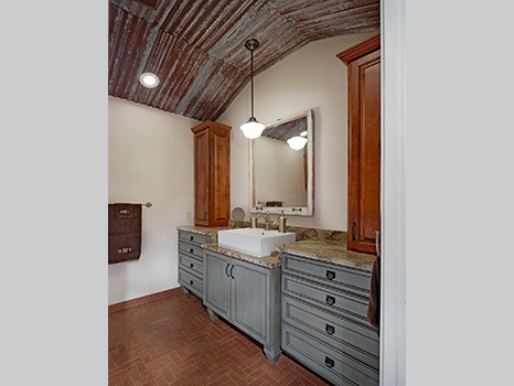 Samuels and Graf even salvaged a portion of the corrugated metal roof from the barn and installed this into the Mulkeys' son’s bathroom.