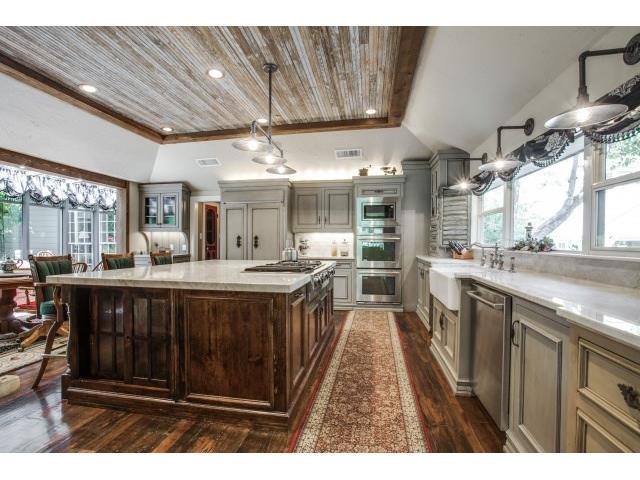 Kitchen with reclaimed wood on ceiling from W. TX ranch