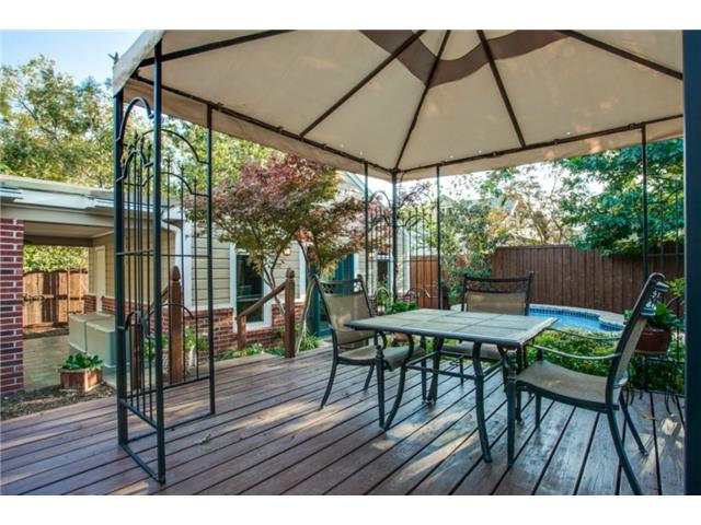 Beautiful deck in the serene backyard.