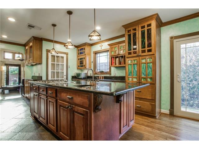 Top-of-the-line kitchen features a large center island, ample co