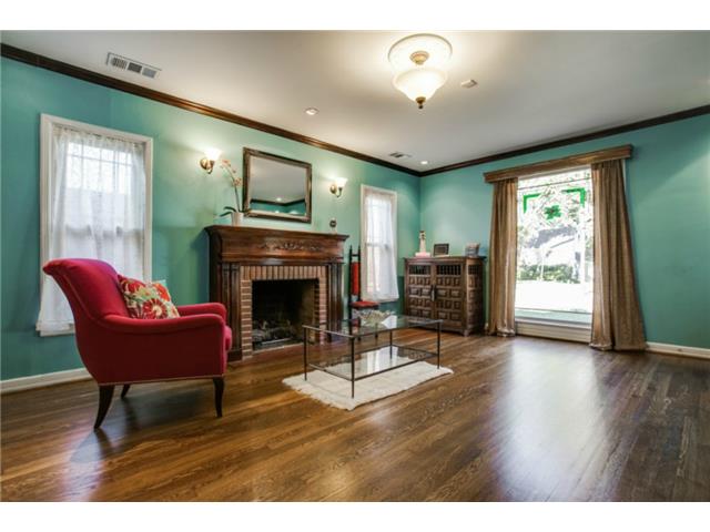 Another view of the formal living room complete with fireplace a