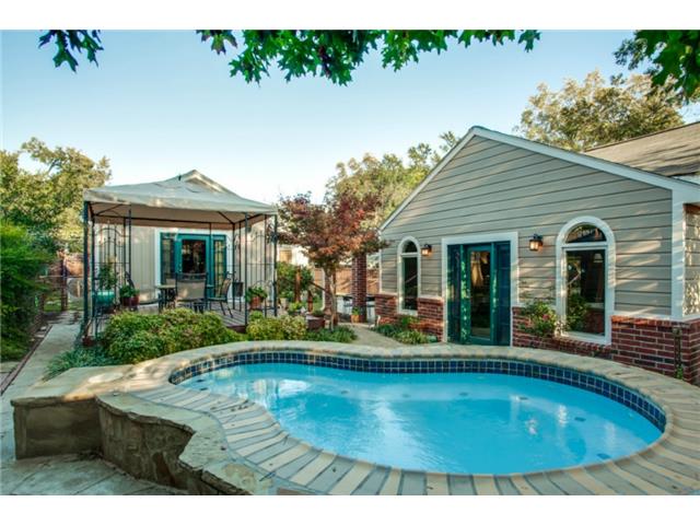 Large spa located in the backyard with the guest quarters.
