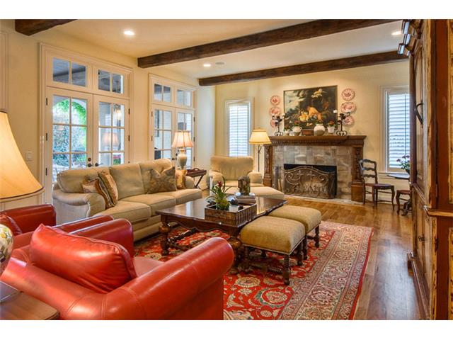The spacious family room is open to the kitchen area & is anchor