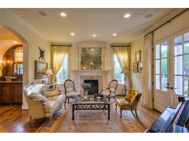 To the right of the foyer is the formal living area. The marble