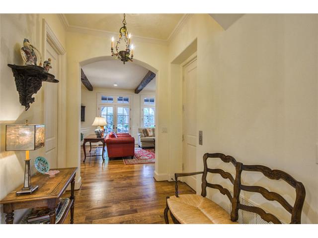 A wide center hallway connects the family room to the foyer prov