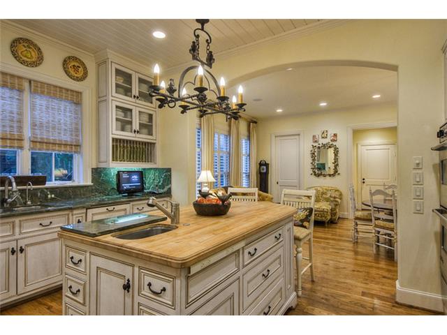 The wide arched opening visually separates the casual dining fro