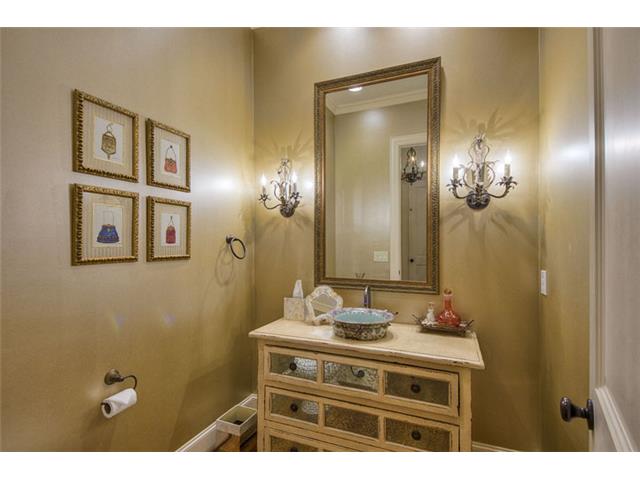 The guest powder bath is generously sized & elegantly appointed.
