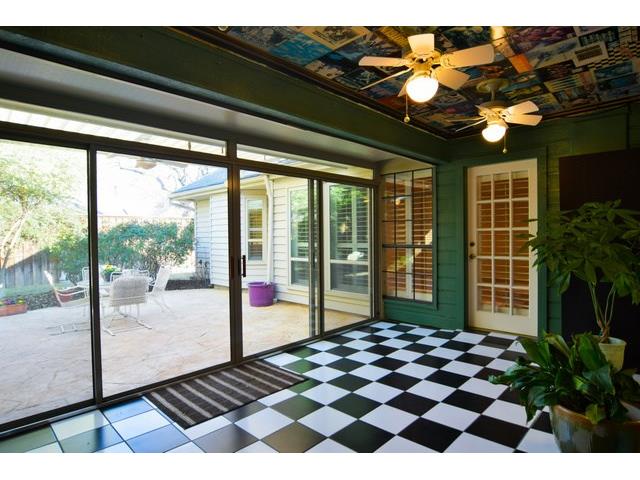 The glass & screens in the air conditioned sunroom slide open