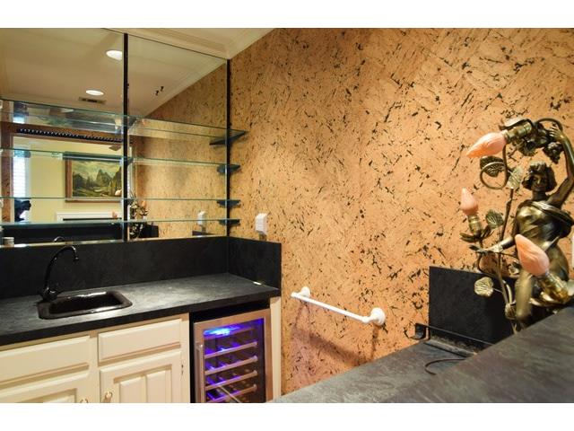 The wet bar open to living & dining