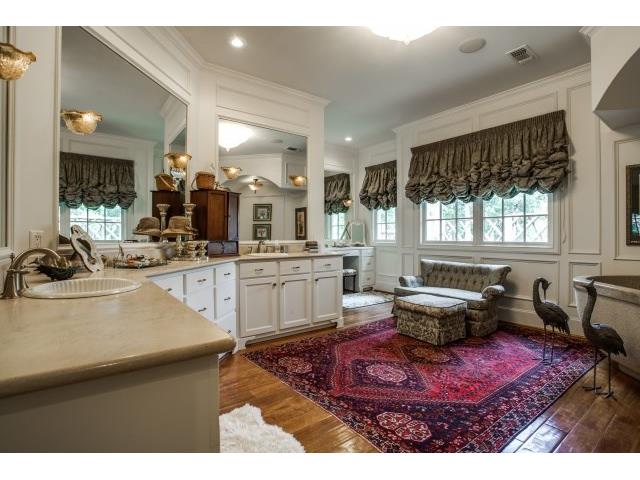 Luxurious master bath with enormous tub, separatevanities.