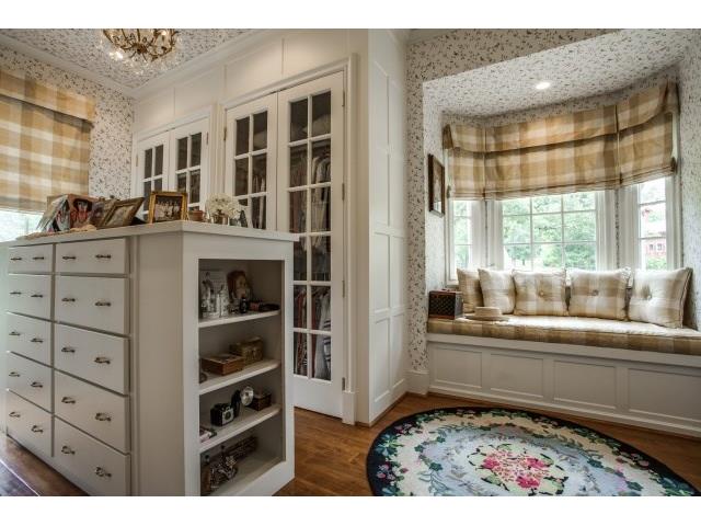 "her" separate closet with beautiful mill work,drawers, bench se