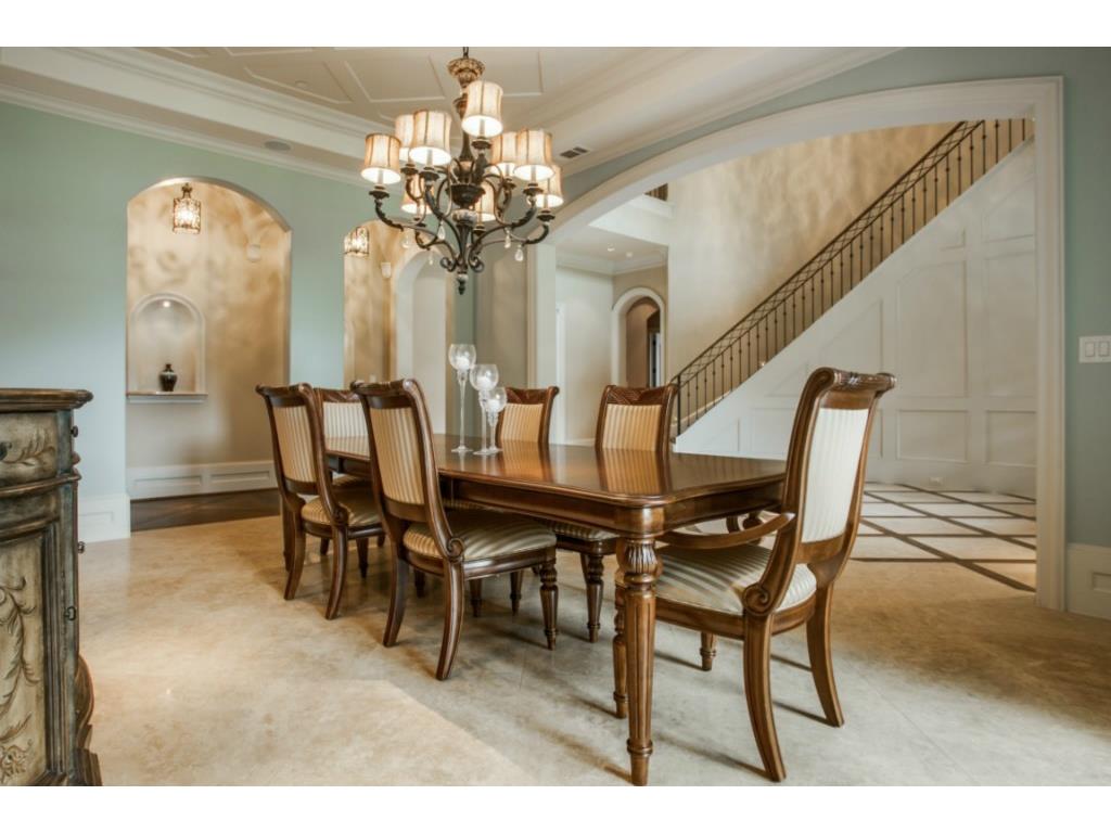 Dining room with travertine floors, wood lattice ceiling and Fre