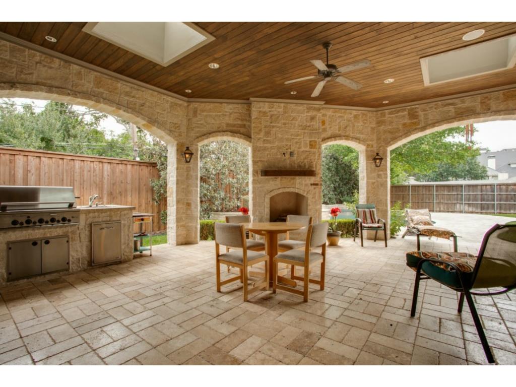 Lovely outdoor living area with kitchen, fireplace, skylights, w