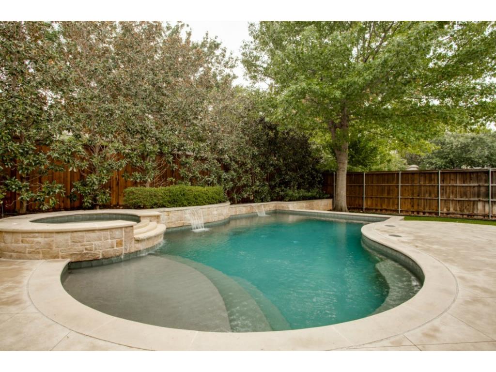 Beautiful pool with spa, tanning deck and waterfalls.  Pool sett
