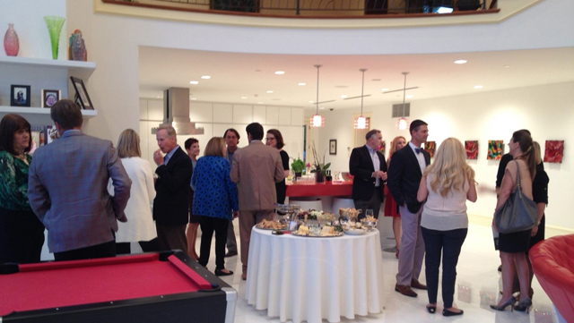 Food and drink were an anchor for some guests, but many took a to-go plate to explore the home.