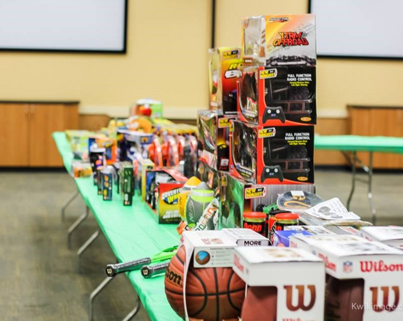 JP & Associates REALTORS holiday scholarship event toys