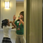 A Project Transformation student and staff member play a game before the organization's May 10 luncheon.
