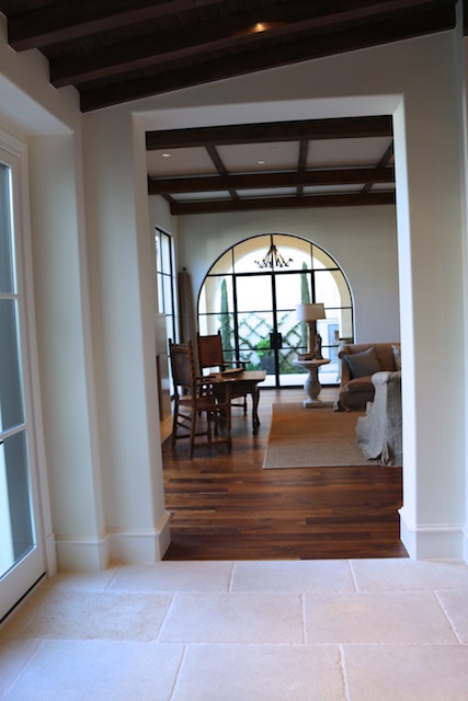 French limestone floors lead to the great room and outdoor courtyard (Photo: Lisa Stewart Photography)