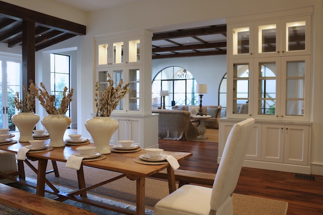 Glass front cabinets define morning and great room spaces (Photo: Lisa Stewart Photography)