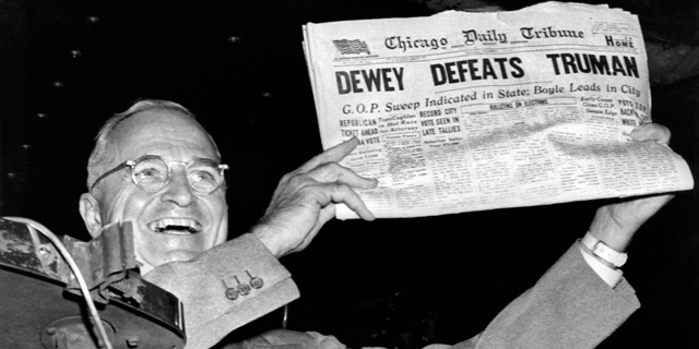 President Harry Truman holds up a copy of the Chicago Daily Tribune declaring his defeat to Thomas Dewey in the presidential election. St. Louis, MIssouri: November, 1948. (Photo by Underwood Archives/Getty Images)