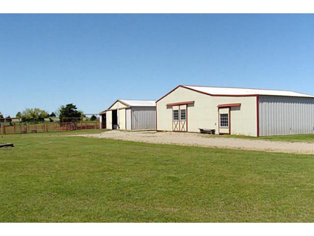 The 8 stall barn in the front and the hay/storage barn in the ba
