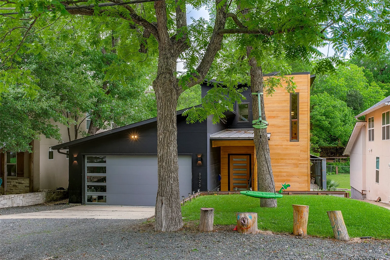 Modern Design with Organic Detail Shapes This Striking Home in Little Forest Hills